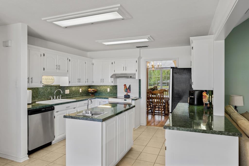 271 VZ County Road Canton, TX 75103 - Photo 15 of 40 a kitchen with granite countertop a sink a counter top space and stainless steel appliances