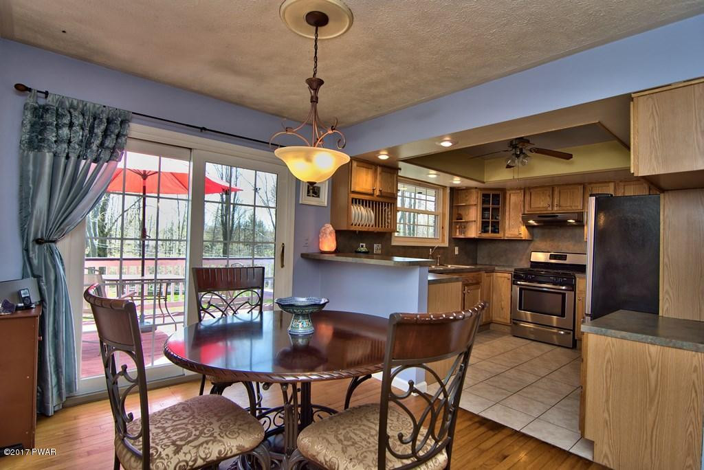 1058 Rosengrant Road Lake Ariel, PA 18436 - Photo 10 of 47 a view of a dining room with furniture window and outside view