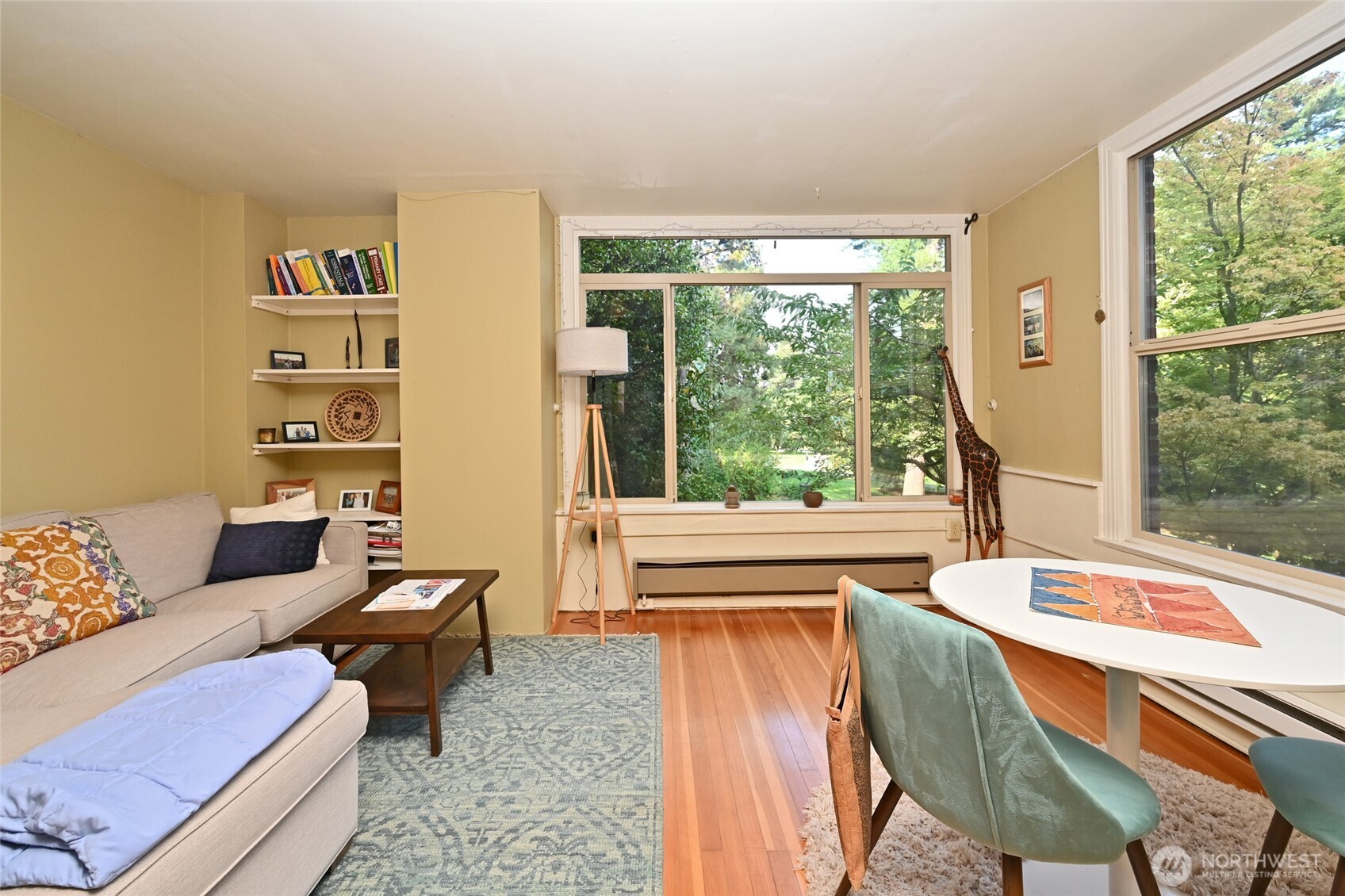 1425 East Prospect Street, Unit 110 Seattle, WA 98112 - Photo 11 of 40 a living room with furniture and a large window