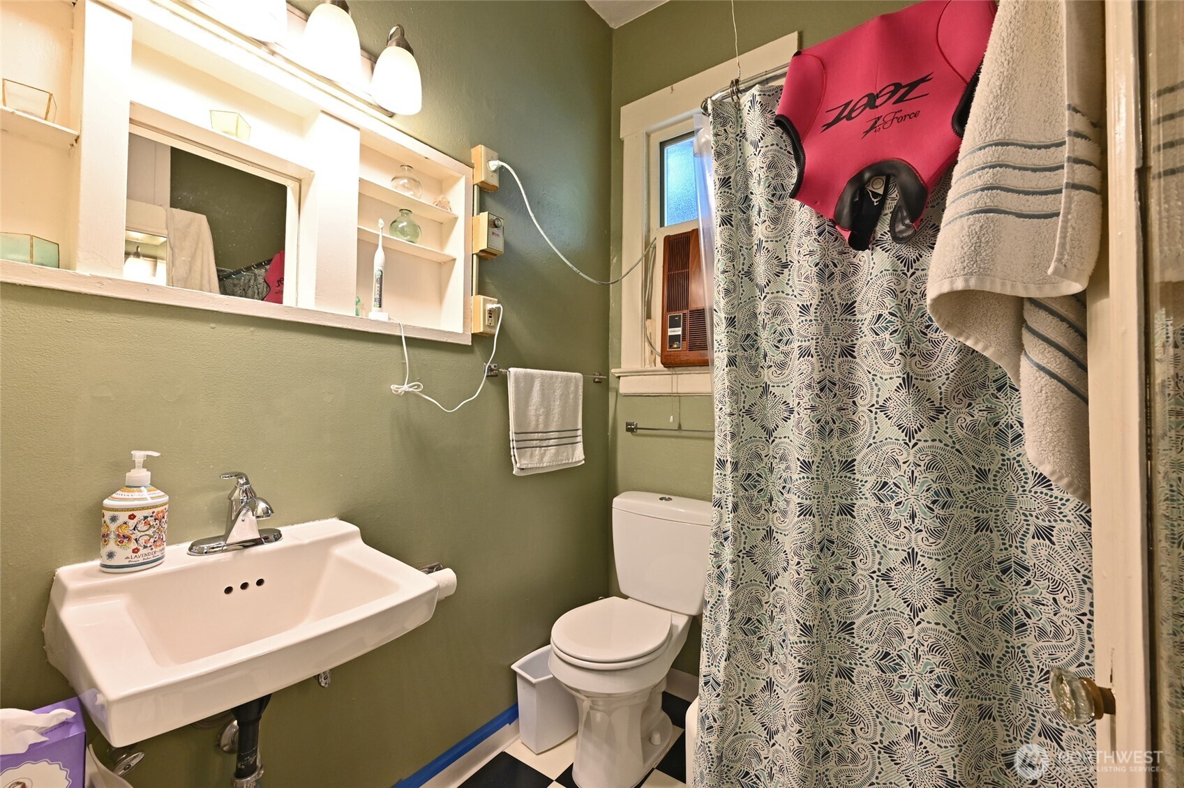 1425 East Prospect Street, Unit 110 Seattle, WA 98112 - Photo 14 of 40 a bathroom with a toilet sink and mirror