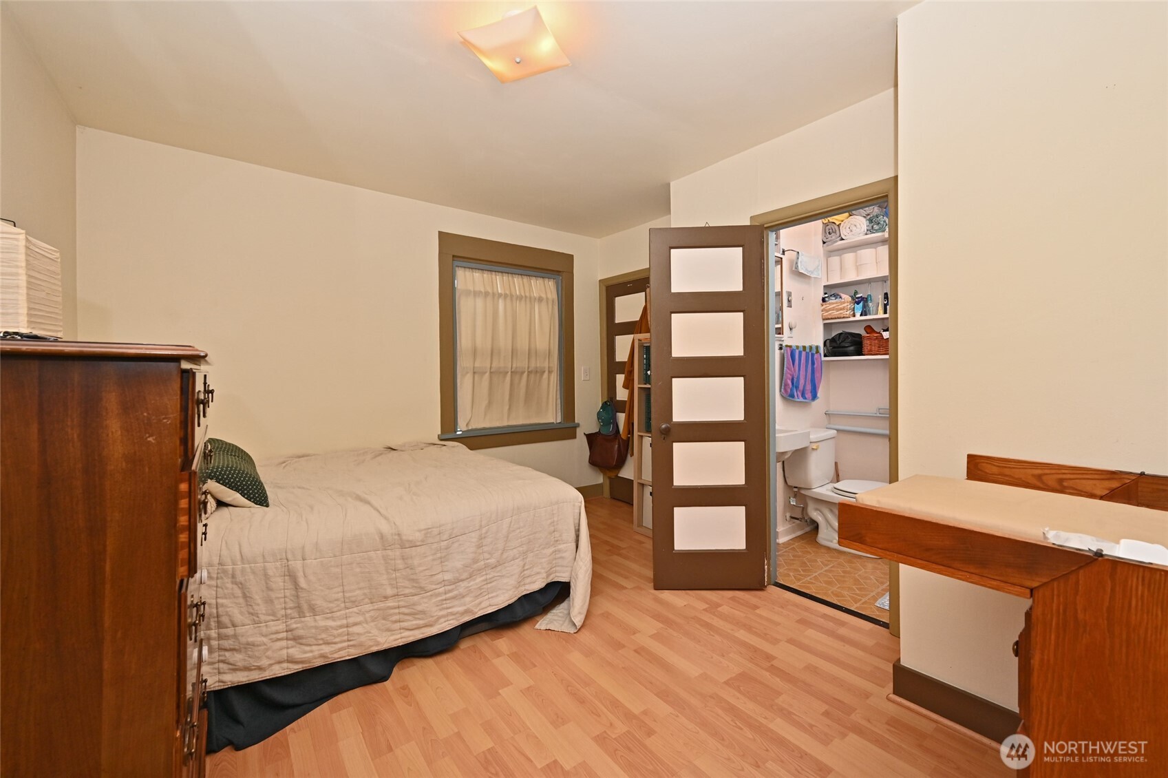 1425 East Prospect Street, Unit 110 Seattle, WA 98112 - Photo 18 of 40 a bedroom with a bed and a window