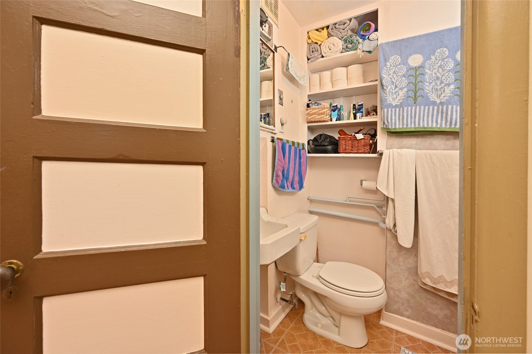 1425 East Prospect Street, Unit 110 Seattle, WA 98112 - Photo 19 of 40 a white toilet sitting next to a window