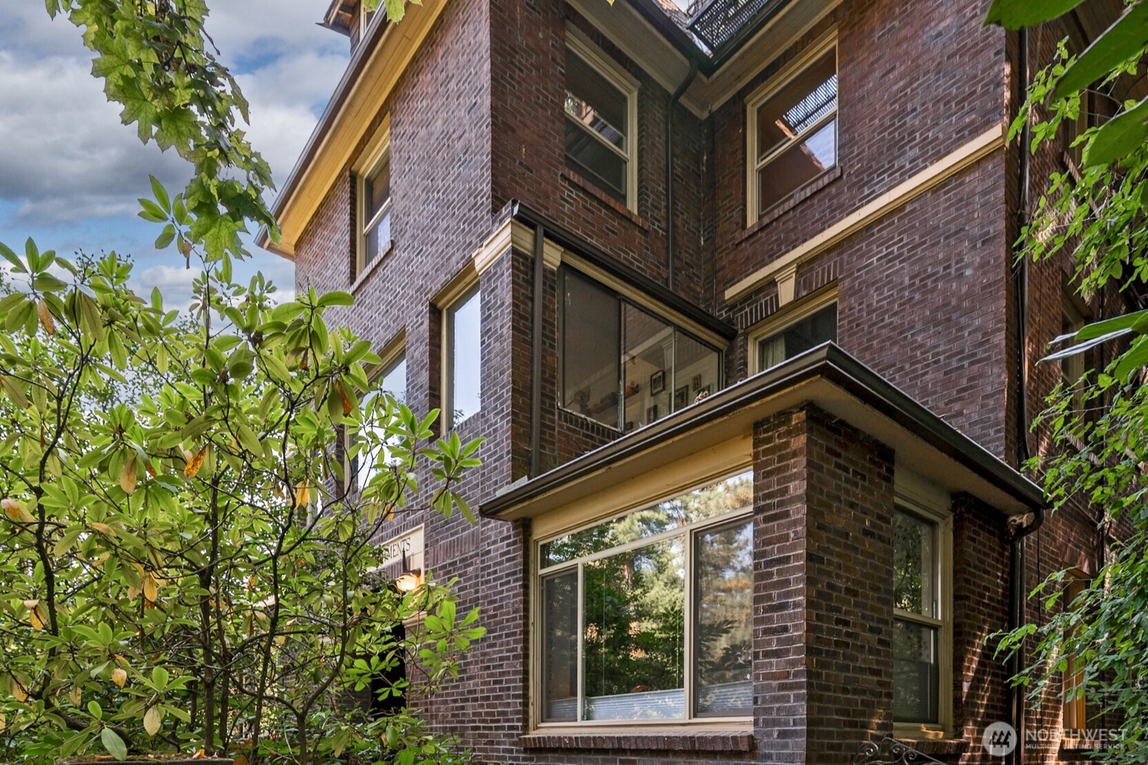 1425 East Prospect Street, Unit 110 Seattle, WA 98112 - Photo 2 of 40 front view of a building with a tree