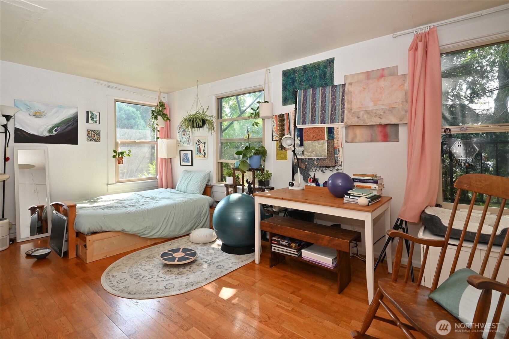 1425 East Prospect Street, Unit 110 Seattle, WA 98112 - Photo 25 of 40 a bedroom with furniture and a wooden floor
