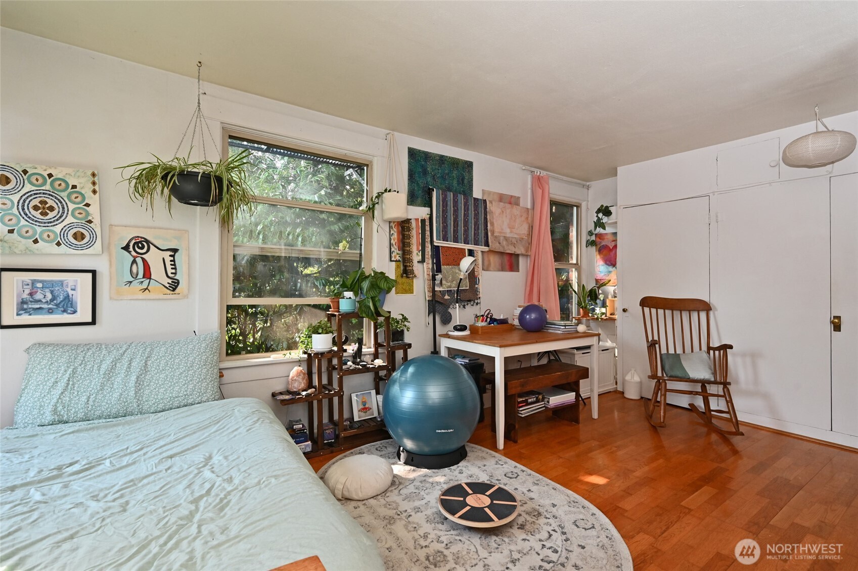 1425 East Prospect Street, Unit 110 Seattle, WA 98112 - Photo 26 of 40 a work room with furniture and a wooden floor
