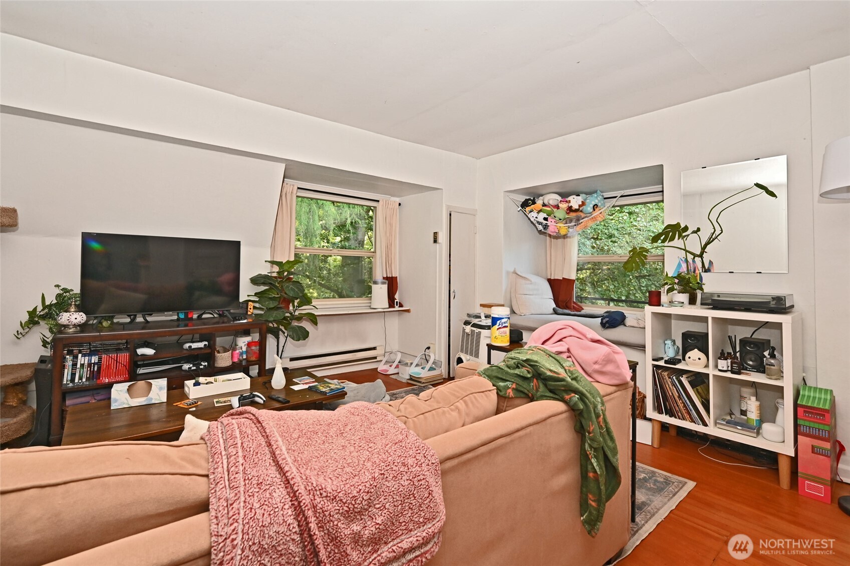 1425 East Prospect Street, Unit 110 Seattle, WA 98112 - Photo 29 of 40 a living room with furniture and a flat screen tv