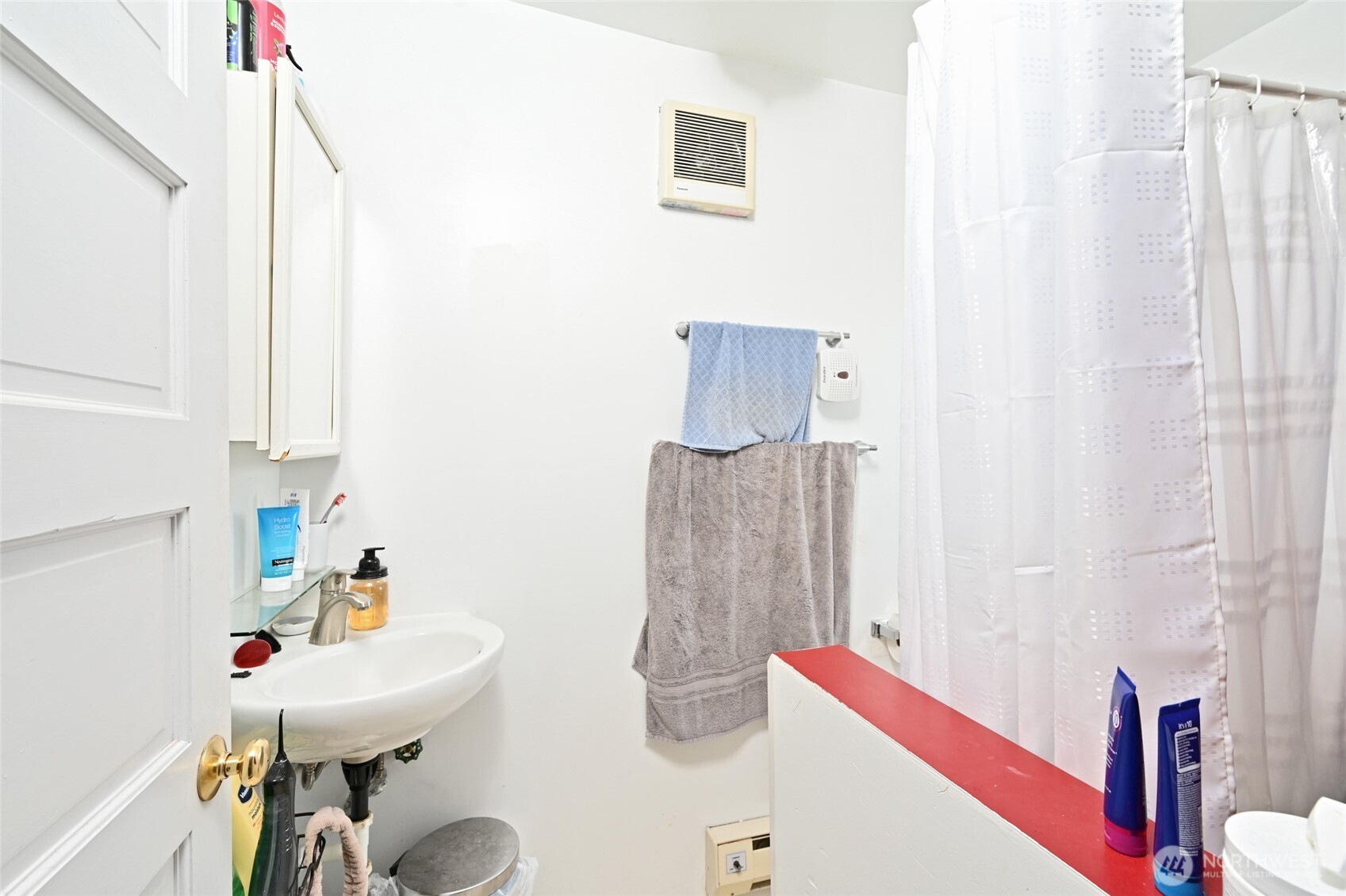 1425 East Prospect Street, Unit 110 Seattle, WA 98112 - Photo 34 of 40 a bathroom with a sink and a mirror