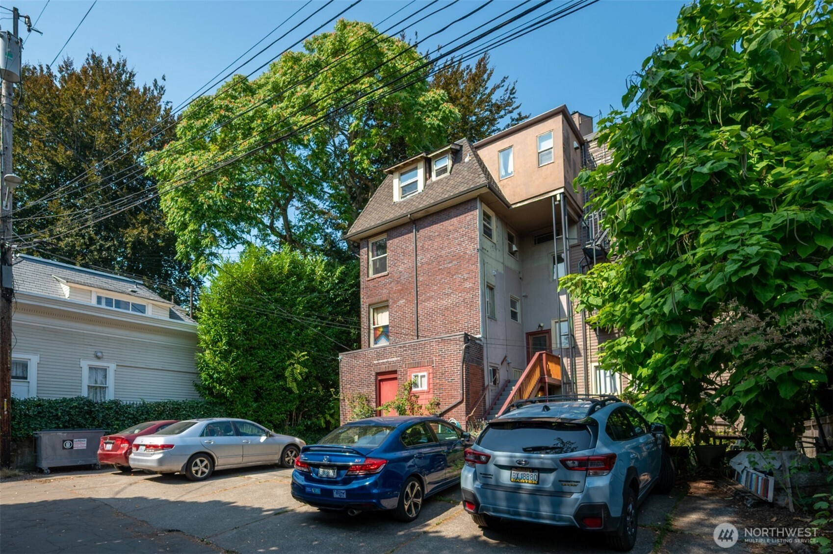 1425 East Prospect Street, Unit 110 Seattle, WA 98112 - Photo 5 of 40 a car parked in front of a house