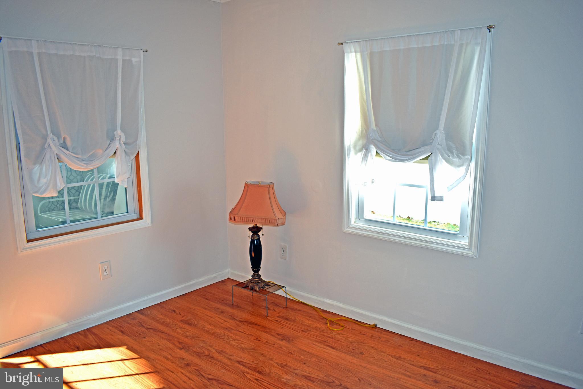 1029 Radio Road Little Egg Harbor, NJ 08087 - Photo 5 of 25 a bedroom with window and a wooden floor