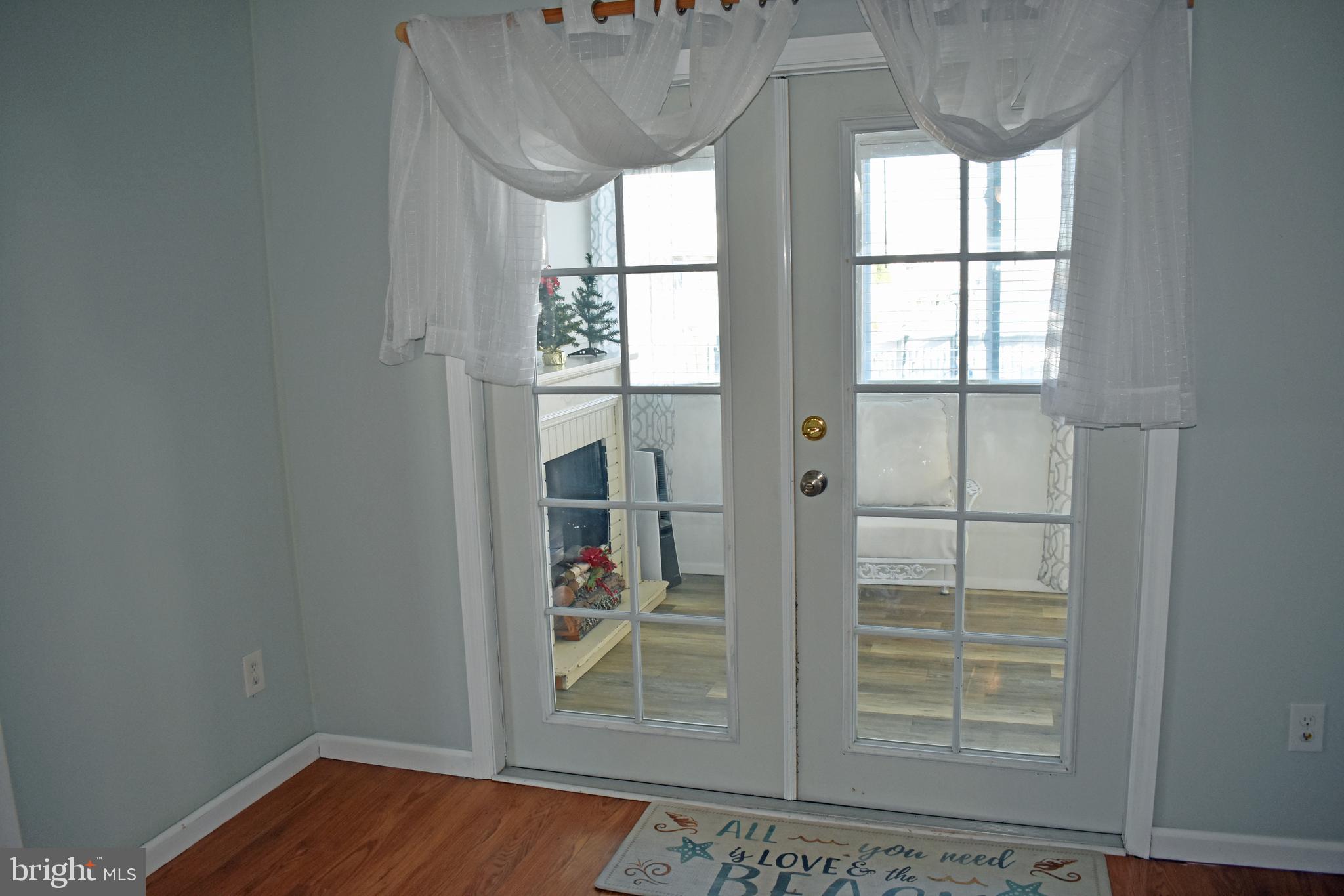 1029 Radio Road Little Egg Harbor, NJ 08087 - Photo 6 of 25 an empty room with wooden floor and windows