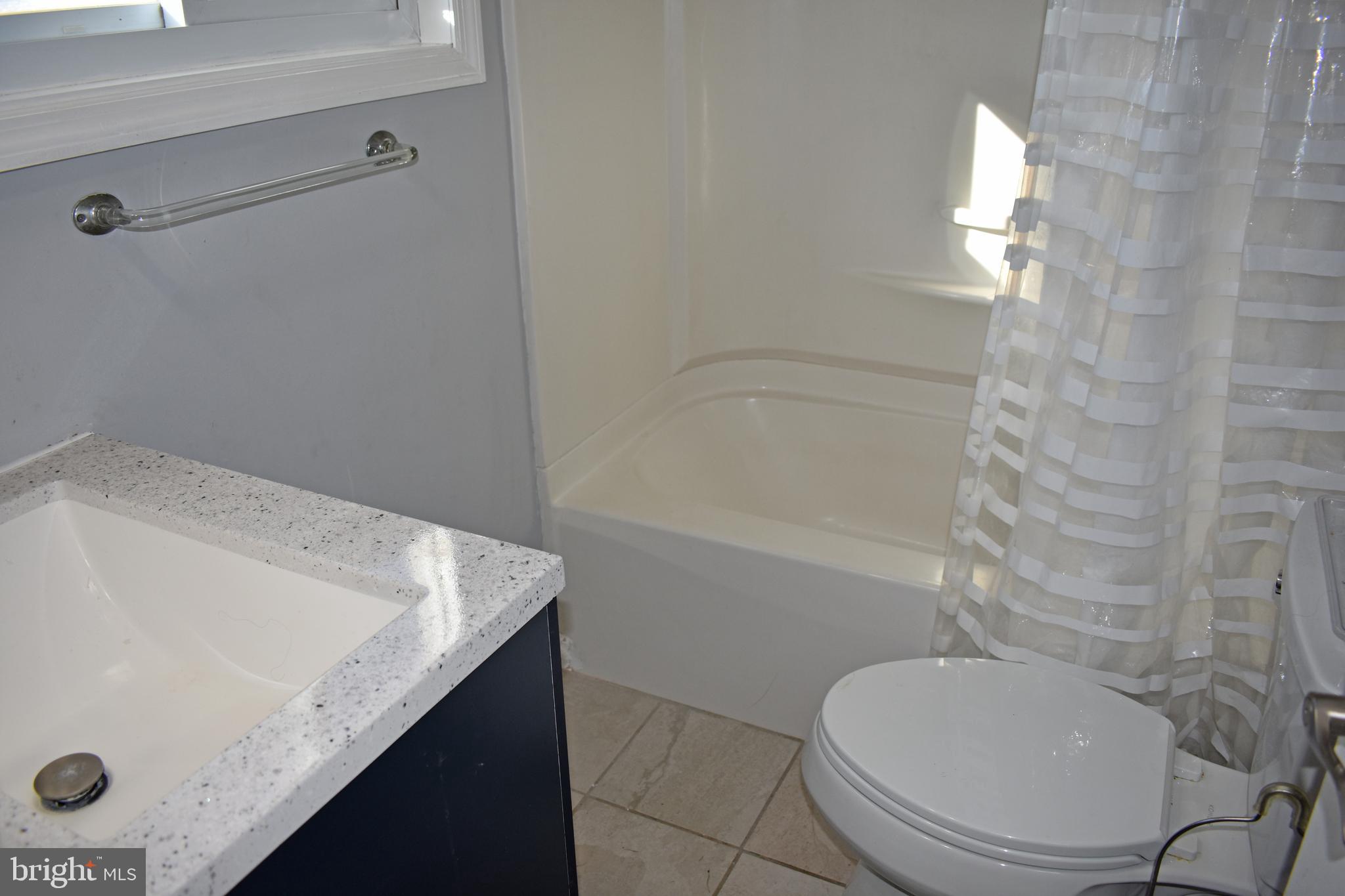 1029 Radio Road Little Egg Harbor, NJ 08087 - Photo 7 of 25 a bathroom with a sink a toilet and shower