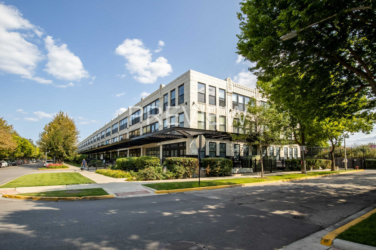 1071 West 15th Street, Unit 351 Chicago, IL 60608 - Photo 1 of 12 a view of a swimming pool with a patio and a yard