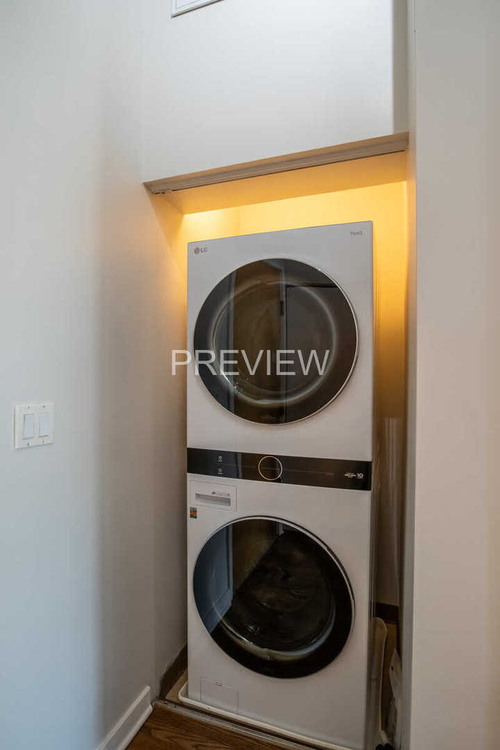 1071 West 15th Street, Unit 351 Chicago, IL 60608 - Photo 3 of 12 a utility room with dryer and washer
