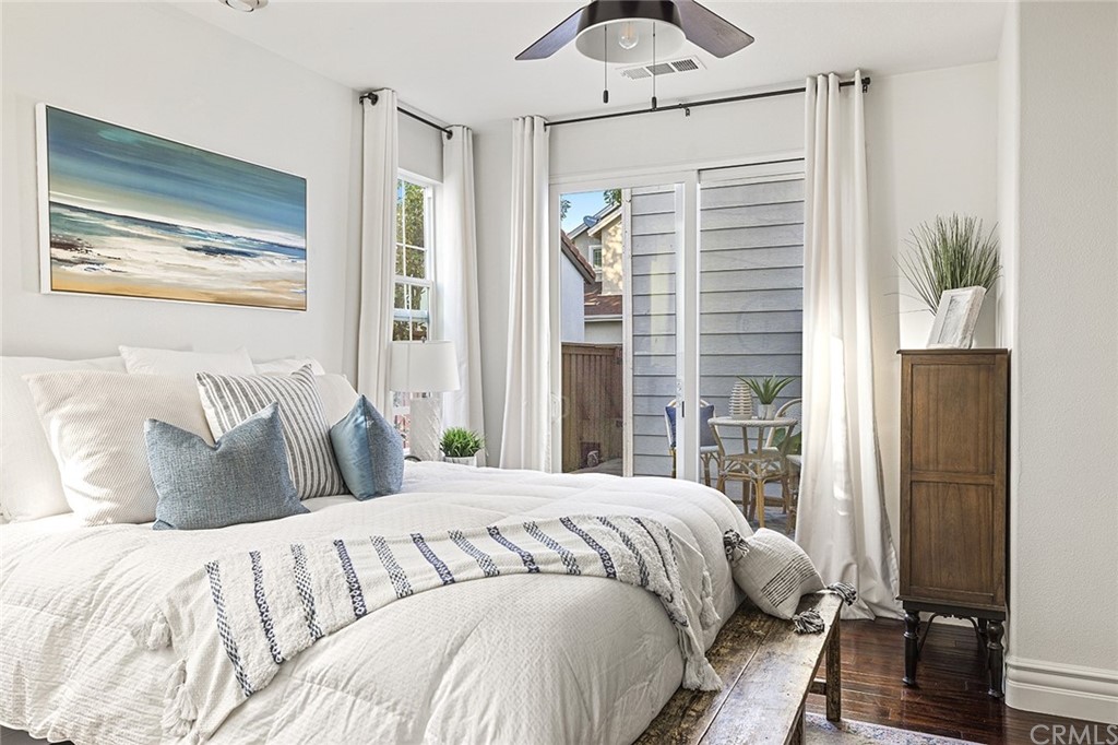 22 Alcott Street Ladera Ranch, CA 92694 - Photo 17 of 46 a bedroom with a large bed and a window