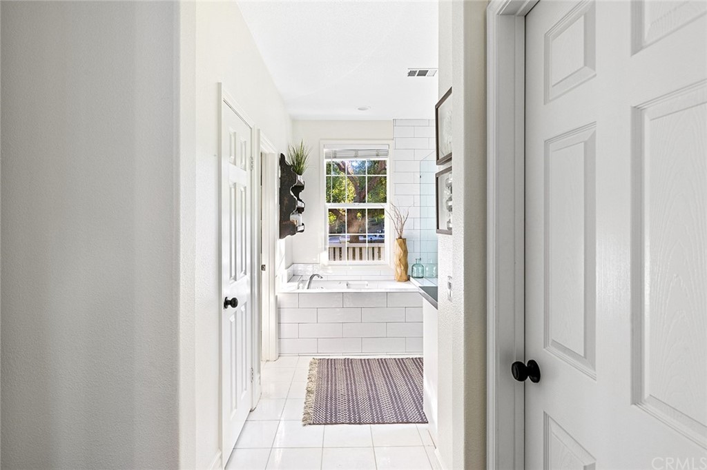 22 Alcott Street Ladera Ranch, CA 92694 - Photo 20 of 46 a view of a walk in closet with wooden floor