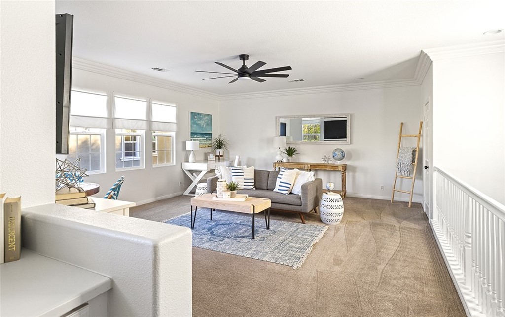 22 Alcott Street Ladera Ranch, CA 92694 - Photo 25 of 46 a living room with furniture and a large window
