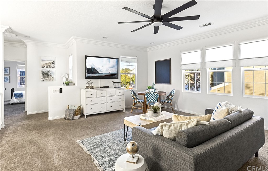 22 Alcott Street Ladera Ranch, CA 92694 - Photo 26 of 46 a living room with furniture and a flat screen tv