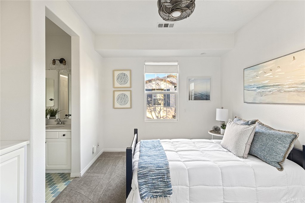 22 Alcott Street Ladera Ranch, CA 92694 - Photo 28 of 46 a bedroom with a bed and a painting on the wall