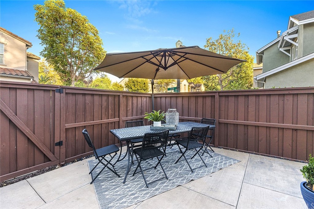 22 Alcott Street Ladera Ranch, CA 92694 - Photo 32 of 46 a patio with a table and chairs