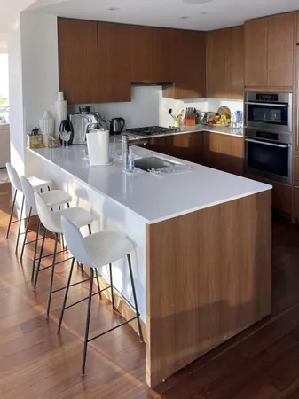 a view of a living room and dining room with furniture wooden floor