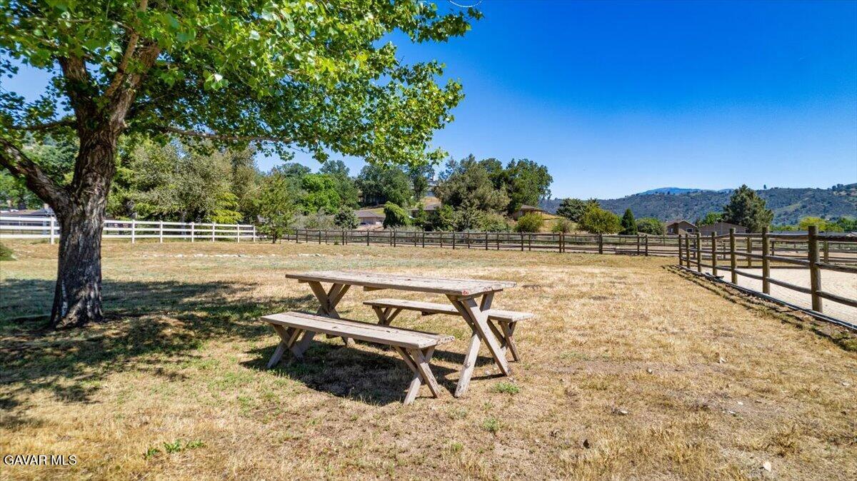 23840 Martingale Way Tehachapi, CA 93561 - Photo 59 of 63 a view of a swimming pool with an outdoor seating and a yard
