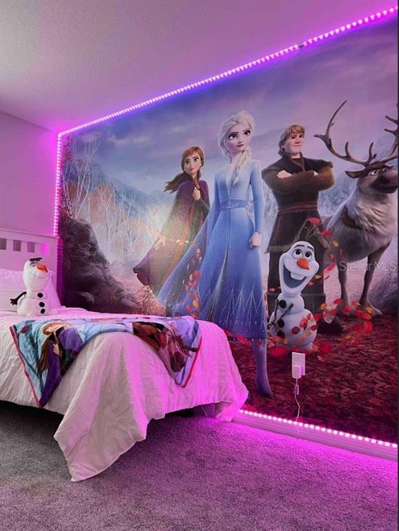 8947 Candy Palm Road Kissimmee, FL 34747 - Photo 15 of 16 a front view of a house with entryway