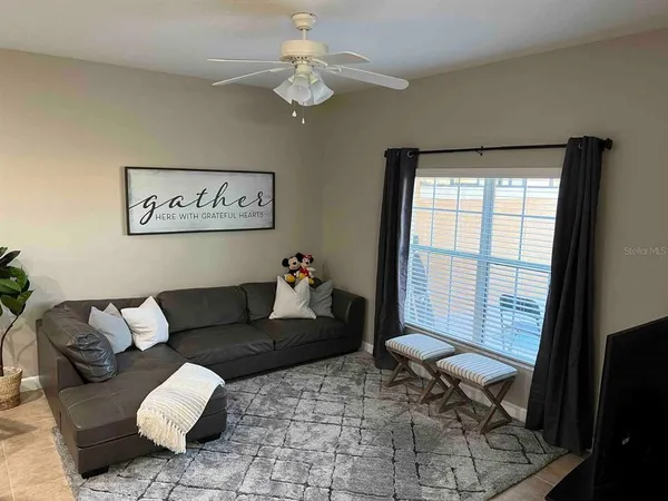 a living room with furniture and a window