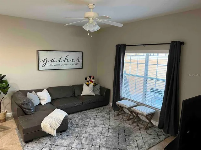 a living room with furniture and a window