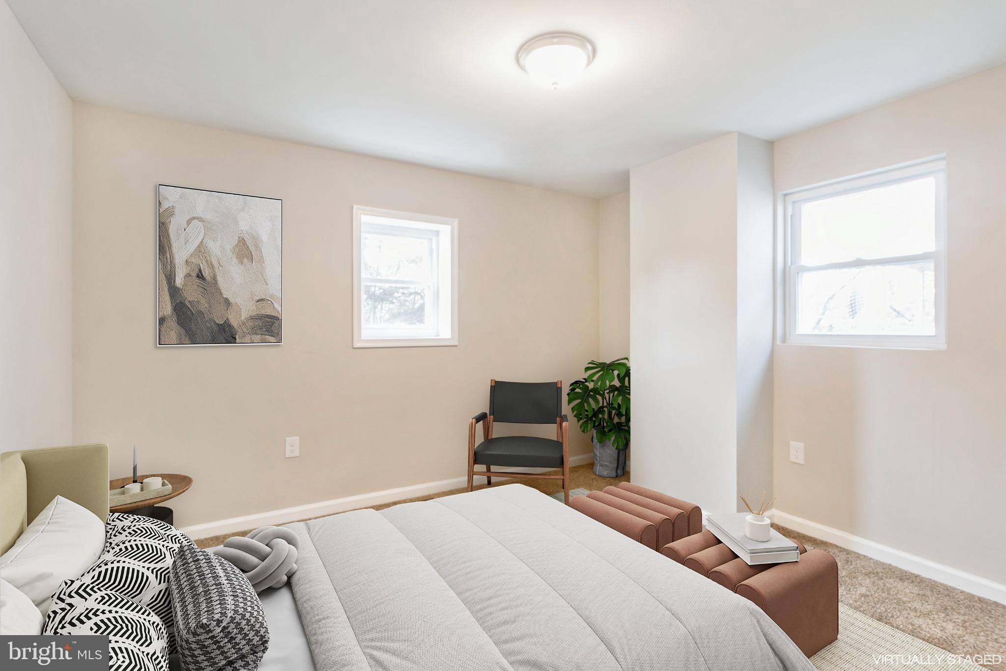 425 Grape Street Warminster, PA 18974 - Photo 16 of 26 a bedroom with a bed and chair