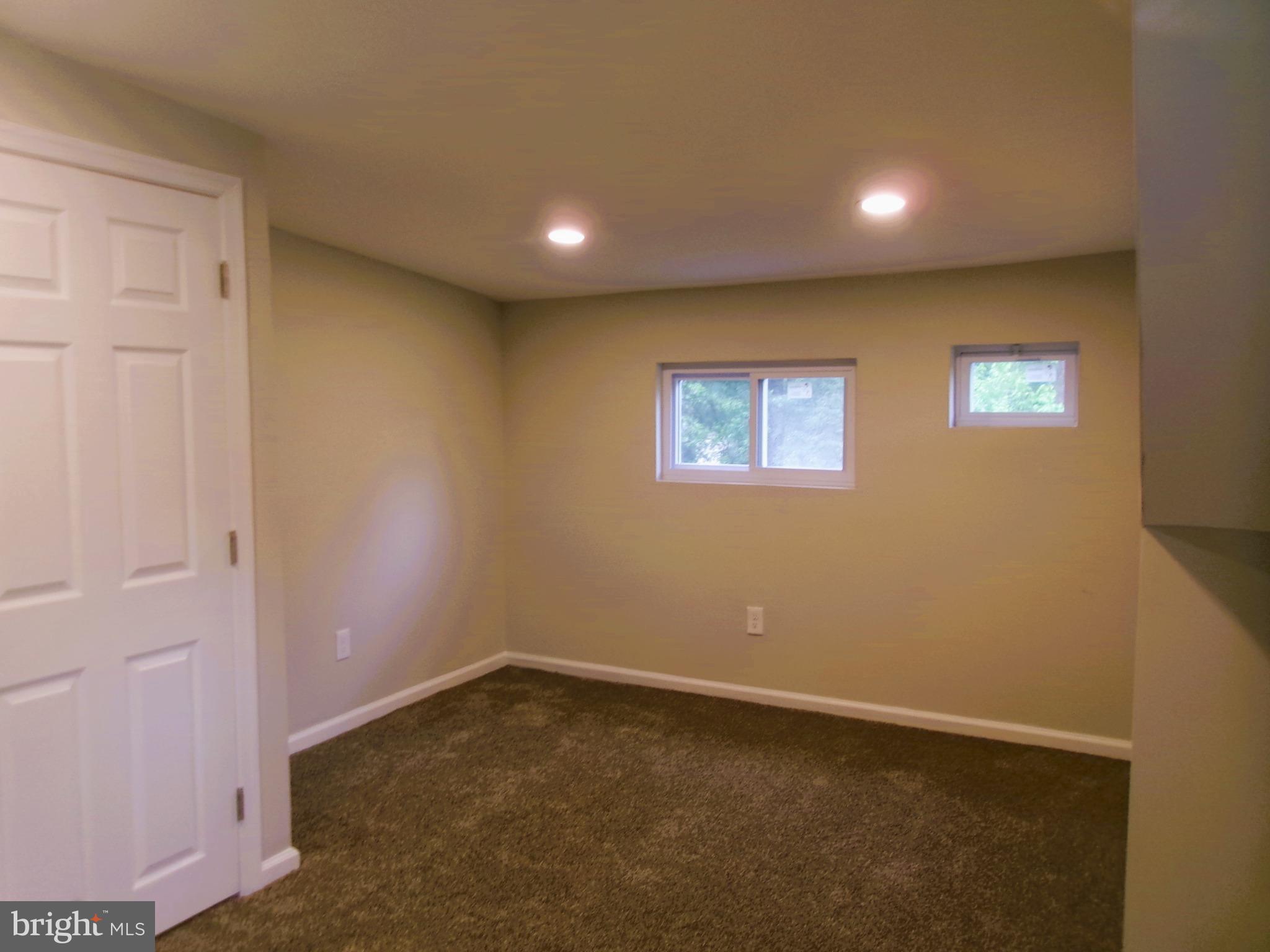 425 Grape Street Warminster, PA 18974 - Photo 23 of 26 an empty room with a empty space and windows