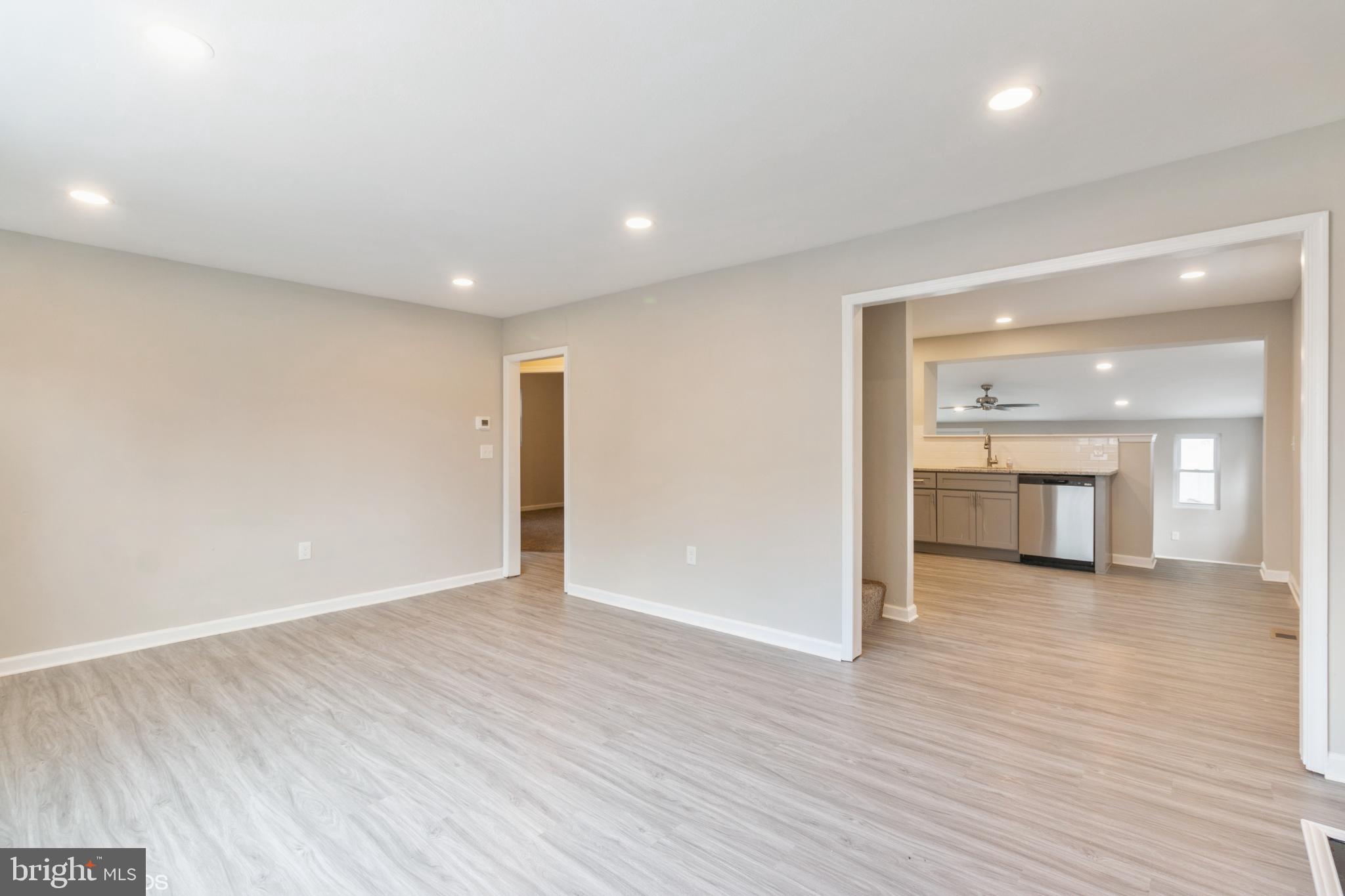 425 Grape Street Warminster, PA 18974 - Photo 3 of 26 an empty room with wooden floor and windows