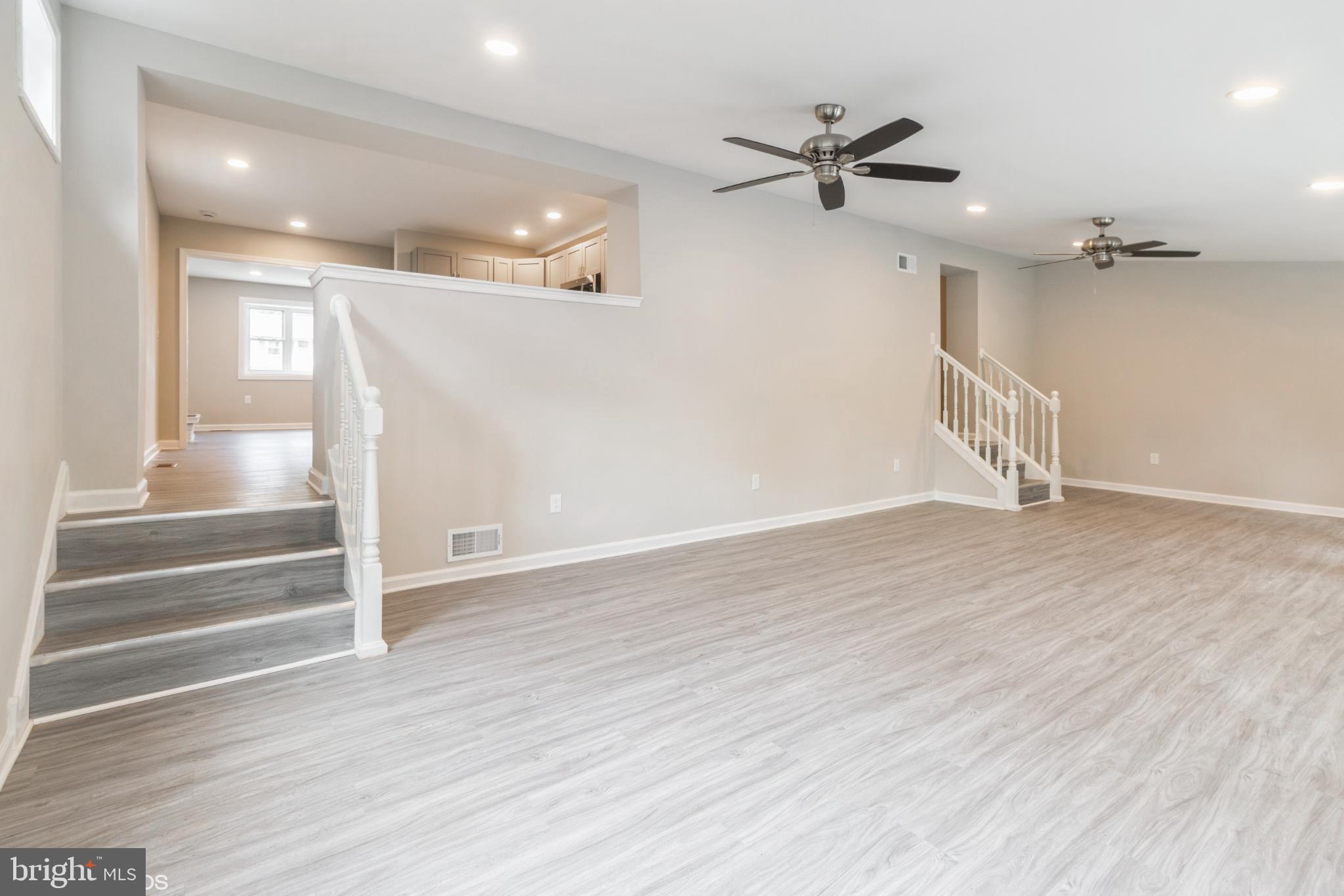 425 Grape Street Warminster, PA 18974 - Photo 10 of 26 wooden floor in an empty room with a ceiling fan