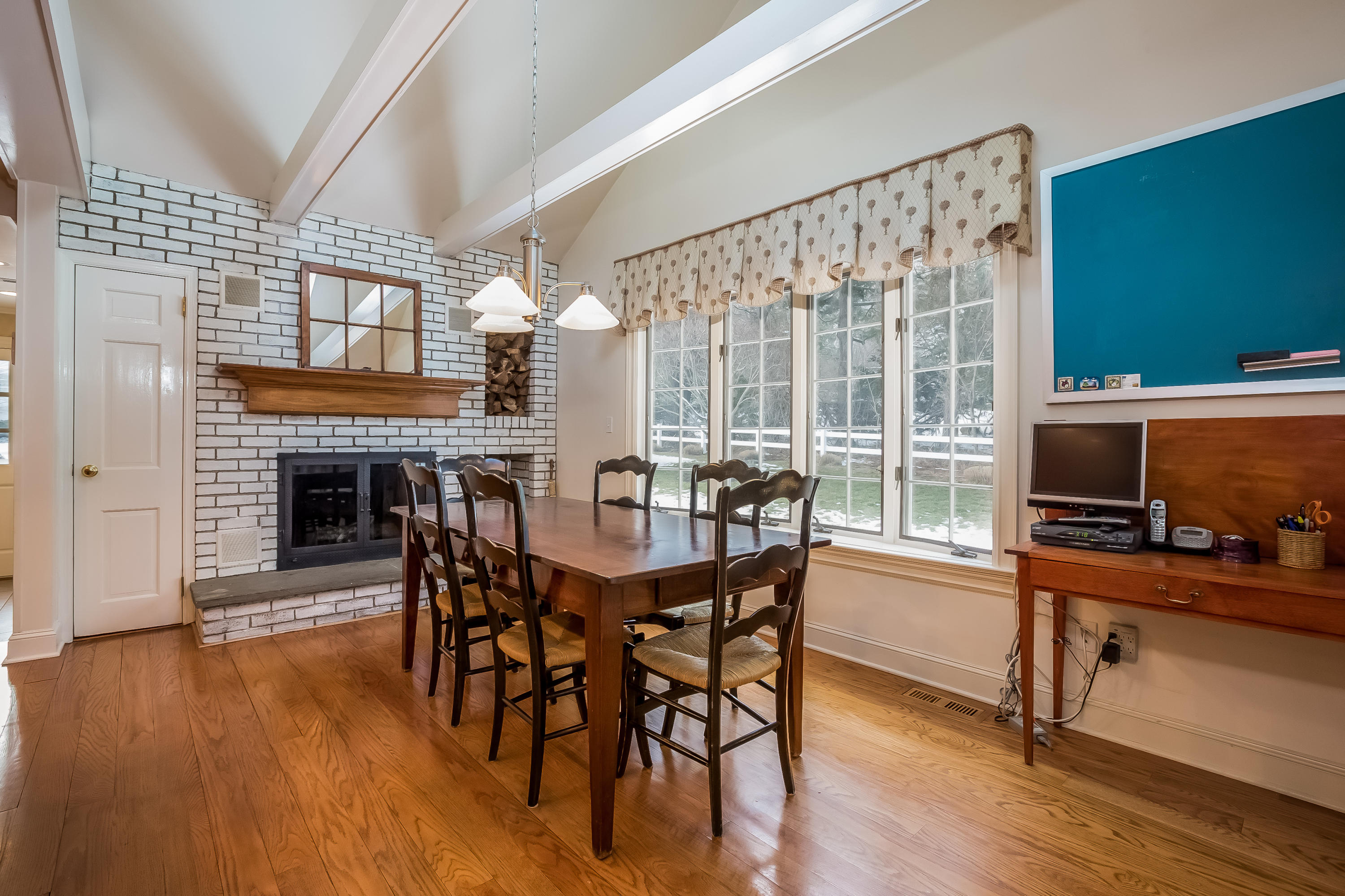 6 Watch Tower Road Darien, CT 06820 - Photo 11 of 30 a view of a dining room with furniture window and wooden floor