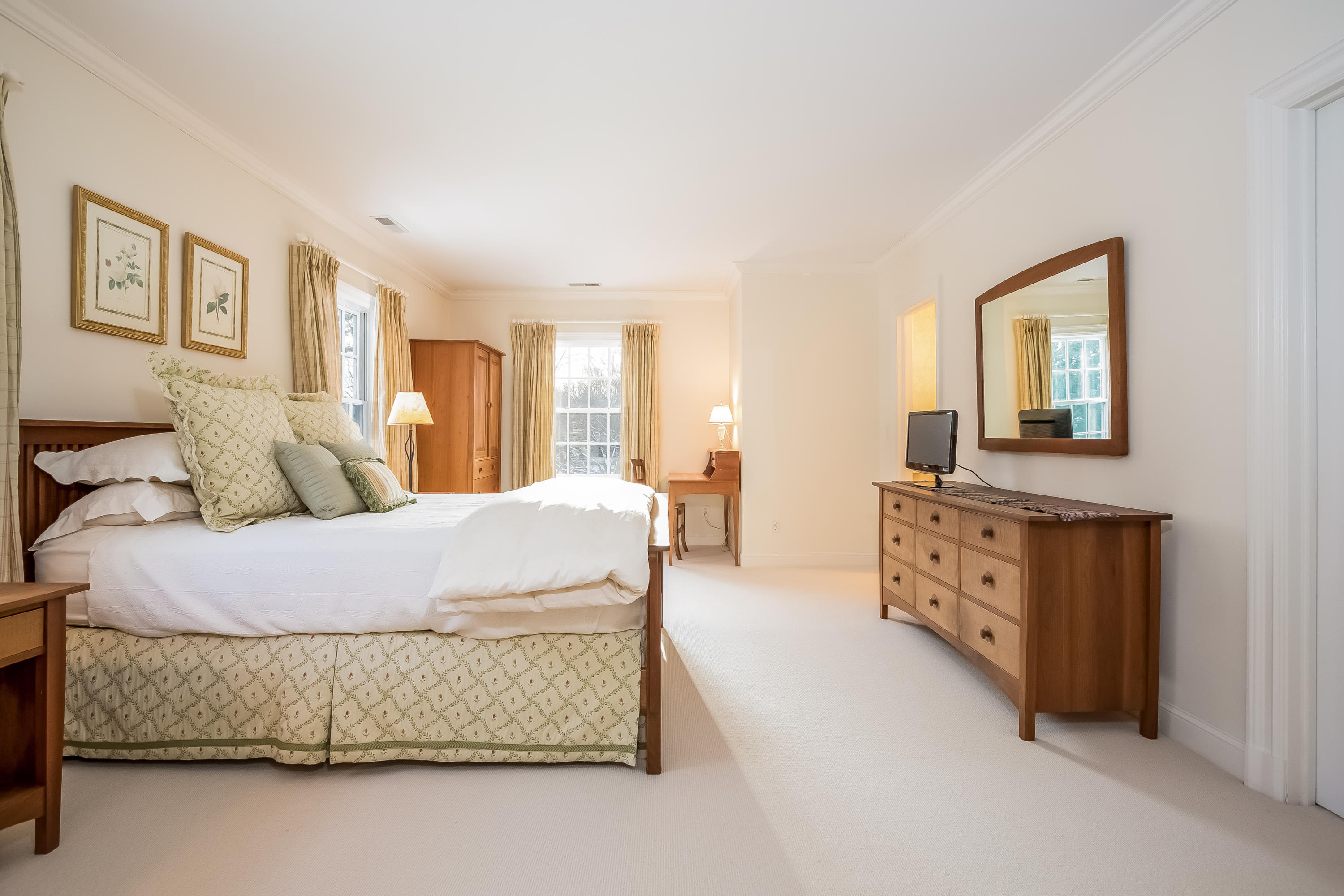 6 Watch Tower Road Darien, CT 06820 - Photo 16 of 30 a bedroom with a bed and dresser