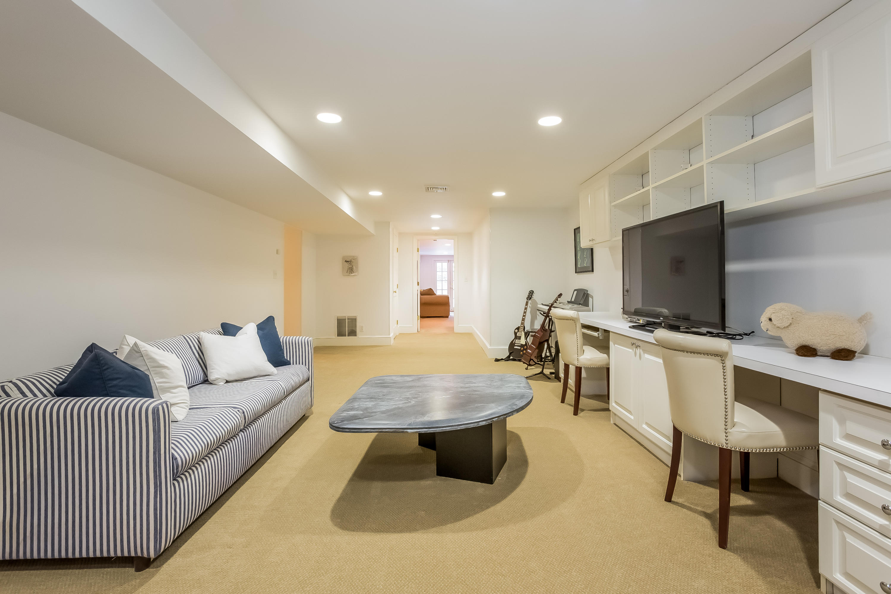 6 Watch Tower Road Darien, CT 06820 - Photo 19 of 30 a living room with furniture and a flat screen tv