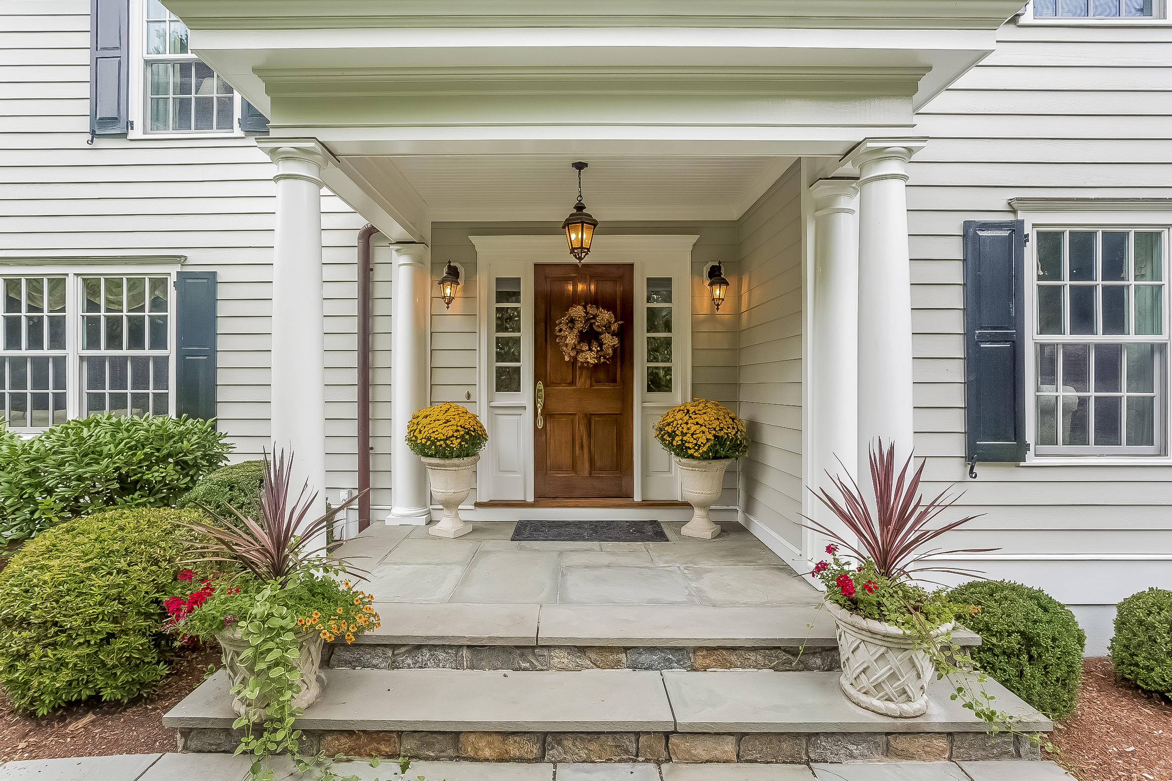6 Watch Tower Road Darien, CT 06820 - Photo 2 of 30 a front view of a house with a porch