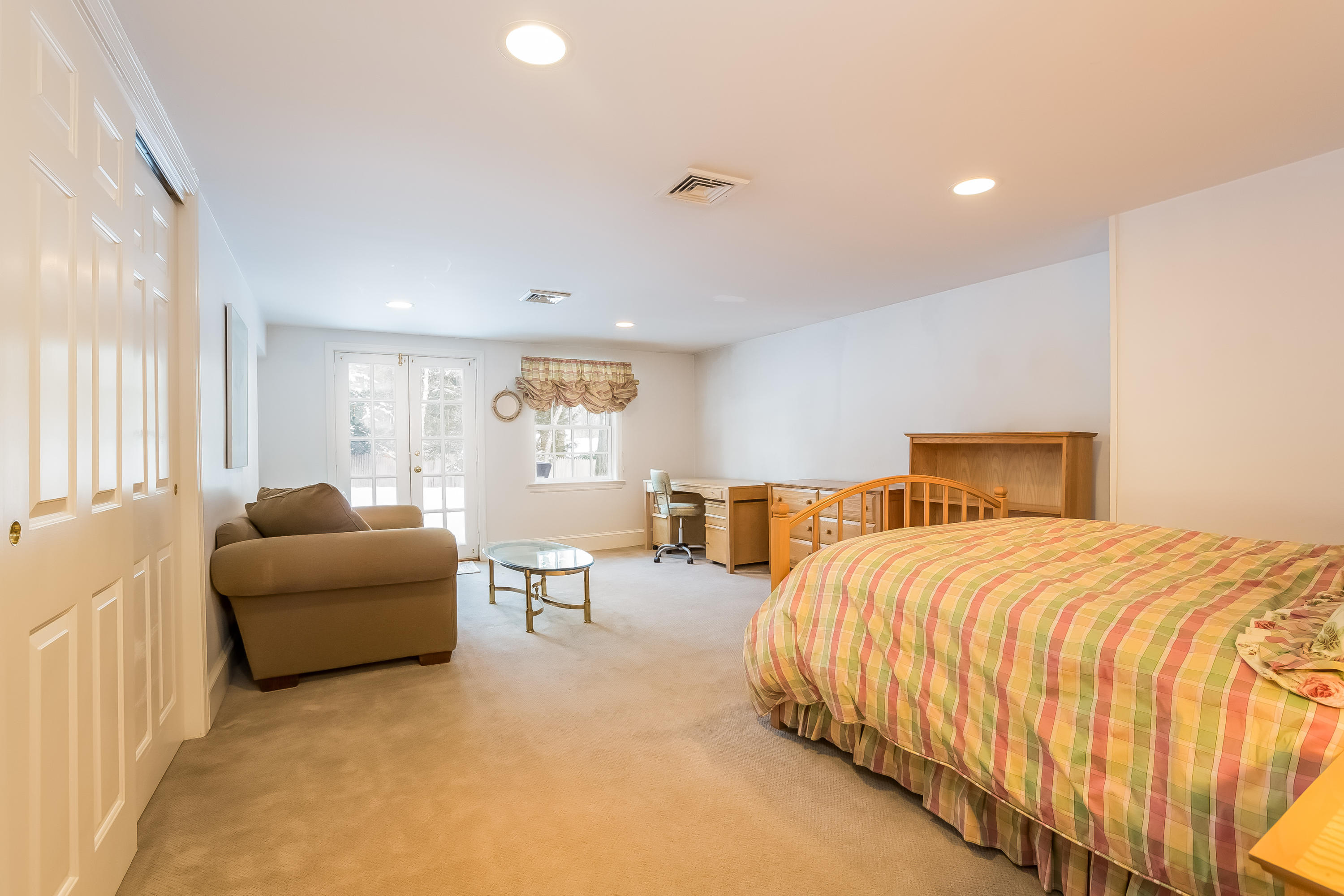 6 Watch Tower Road Darien, CT 06820 - Photo 21 of 30 a bedroom with a bed and a couch