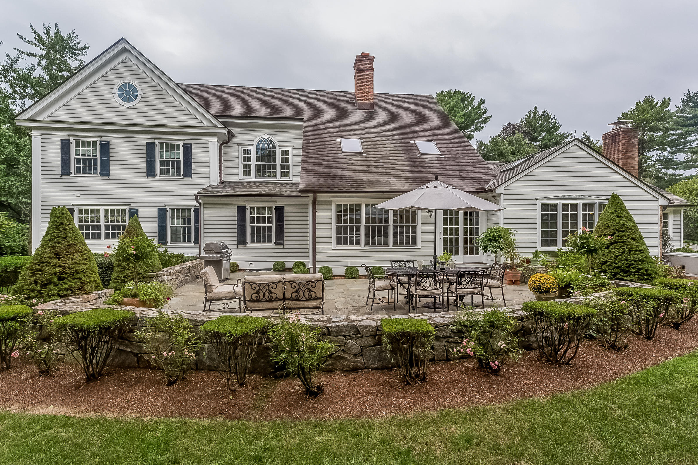6 Watch Tower Road Darien, CT 06820 - Photo 24 of 30 a front view of a house with a yard