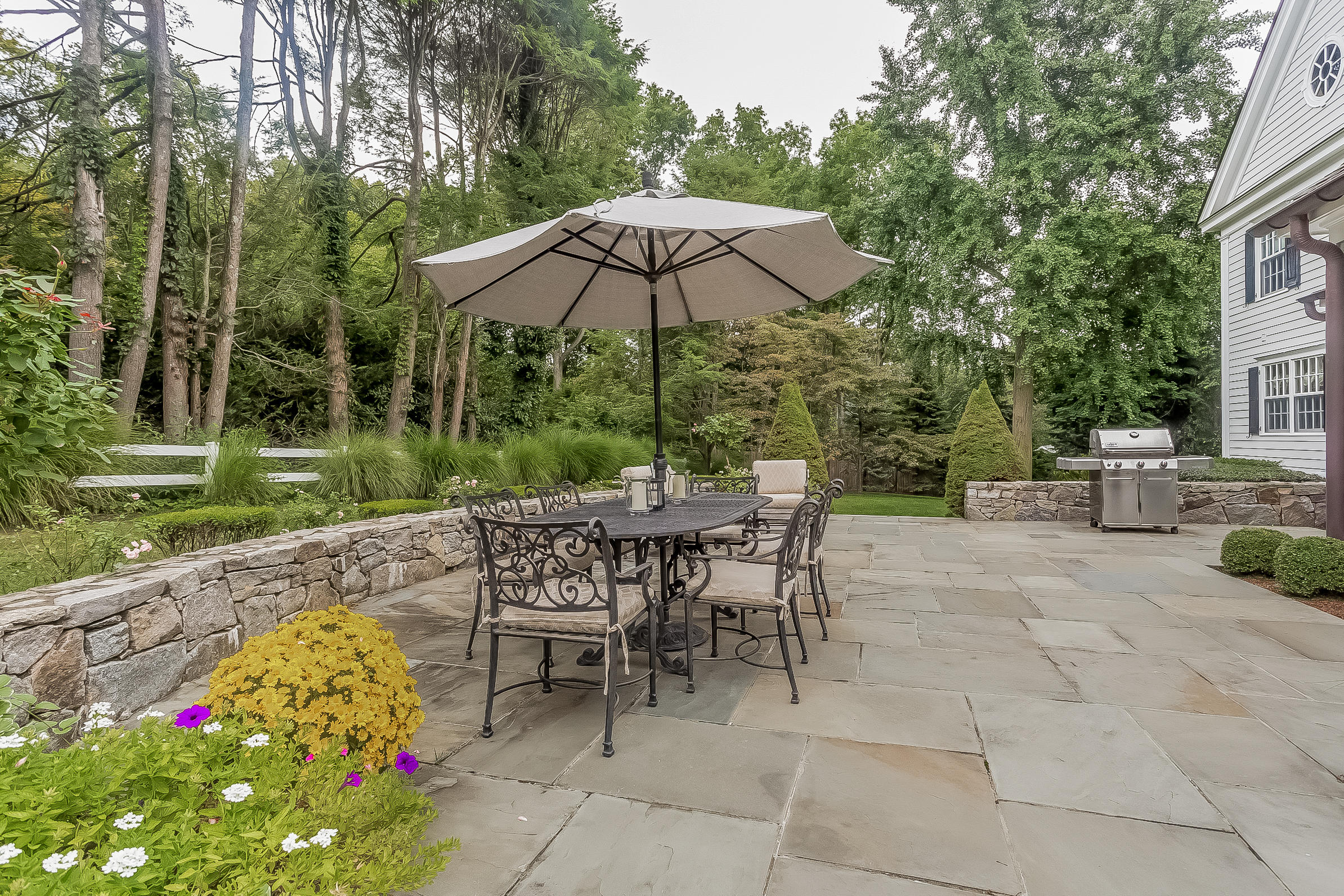 6 Watch Tower Road Darien, CT 06820 - Photo 25 of 30 a view of backyard with seating space and umbrella