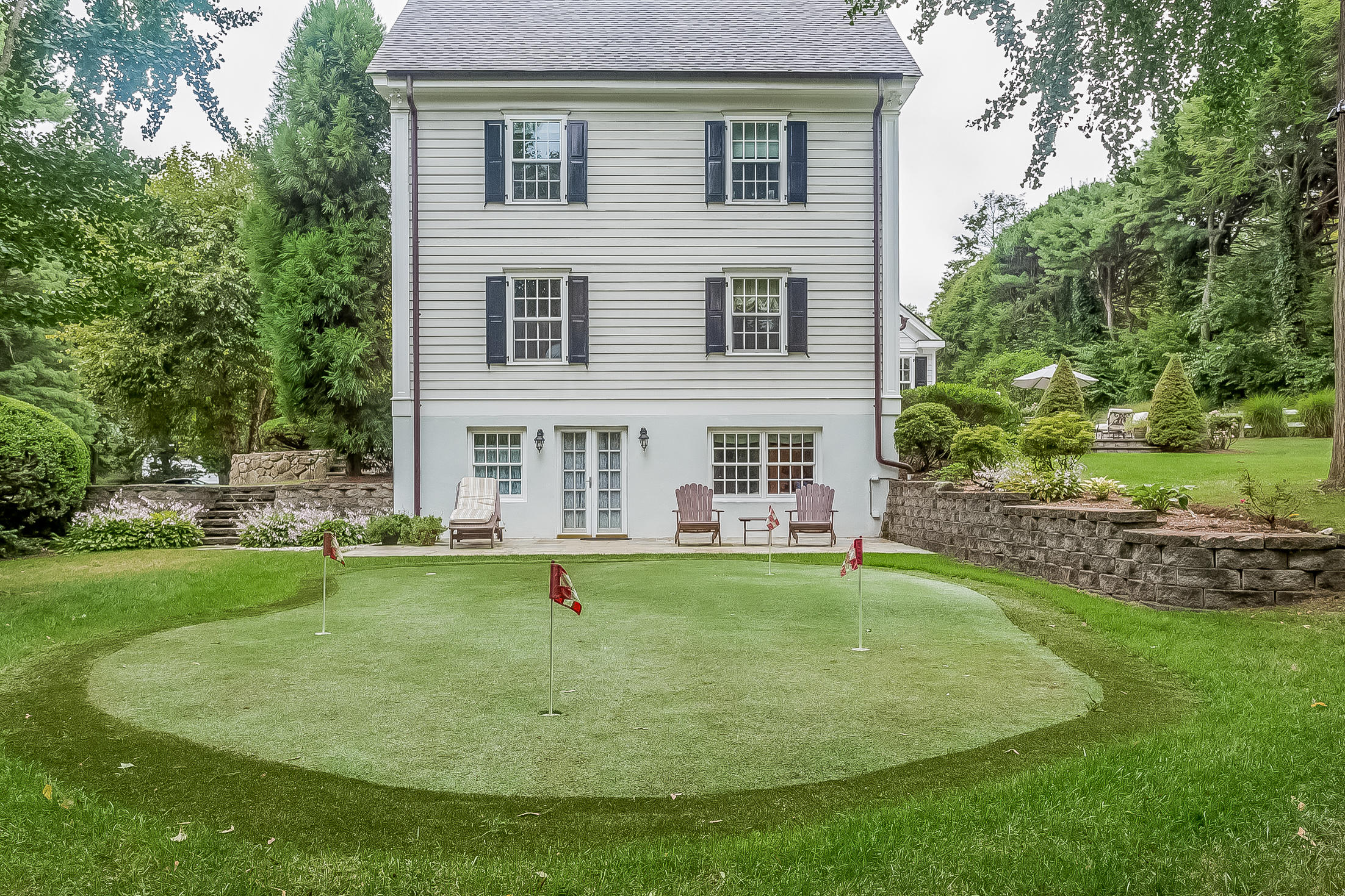 6 Watch Tower Road Darien, CT 06820 - Photo 27 of 30 a view of a house with a yard porch and sitting area