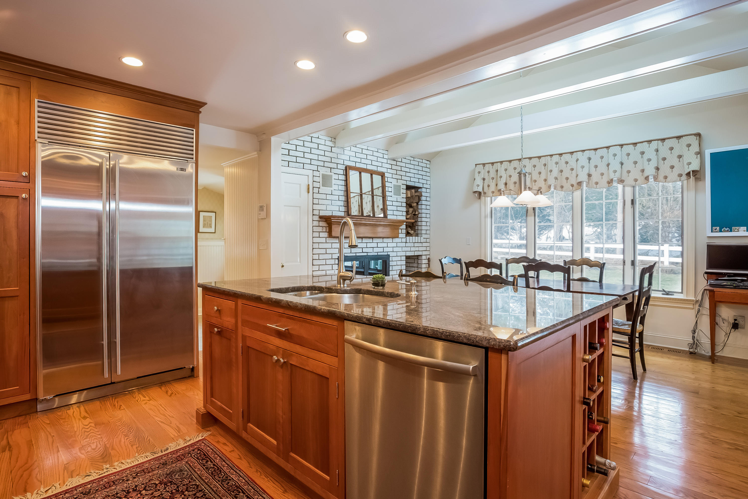 6 Watch Tower Road Darien, CT 06820 - Photo 9 of 30 a kitchen with stainless steel appliances granite countertop a sink and a refrigerator