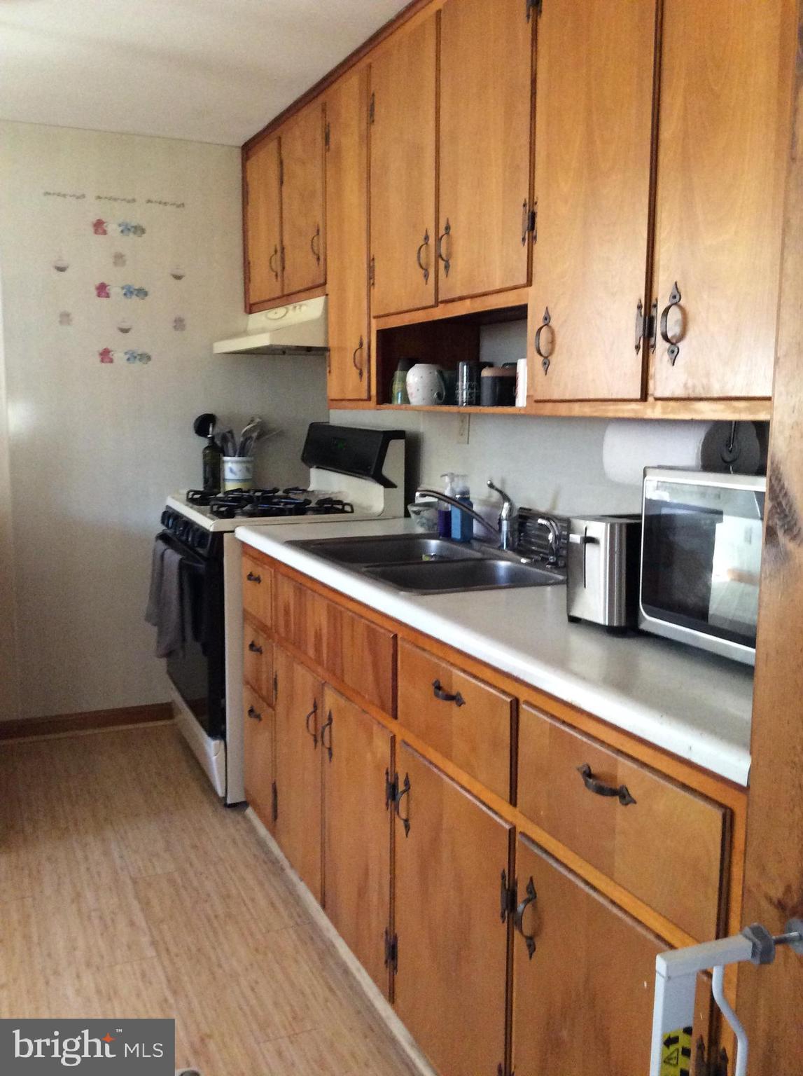 319 Red Lion Branch Road Millington, MD 21651 - Photo 11 of 31 a kitchen with stainless steel appliances granite countertop a sink a stove and white cabinets