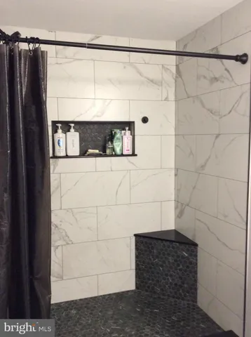 a bathroom with a sink toilet and mirror