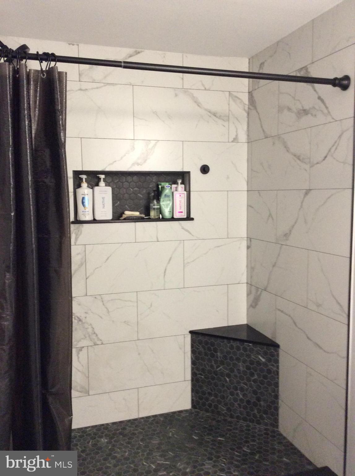 319 Red Lion Branch Road Millington, MD 21651 - Photo 17 of 31 a bathroom with a shower and a window