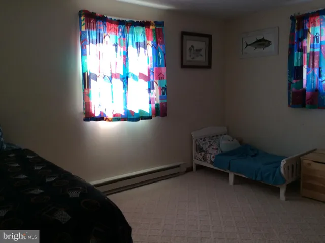 a bedroom with a bed and utility room