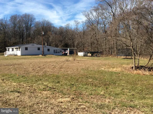 a backyard of apartments with large trees