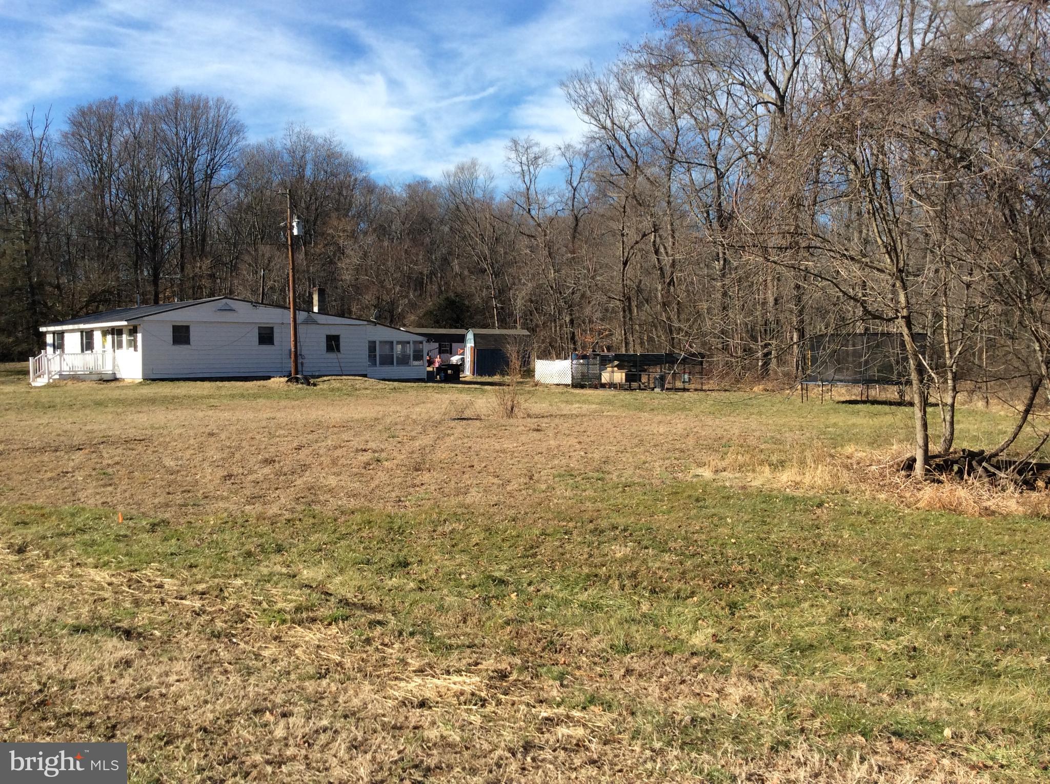 319 Red Lion Branch Road Millington, MD 21651 - Photo 2 of 31 a backyard of apartments with large trees