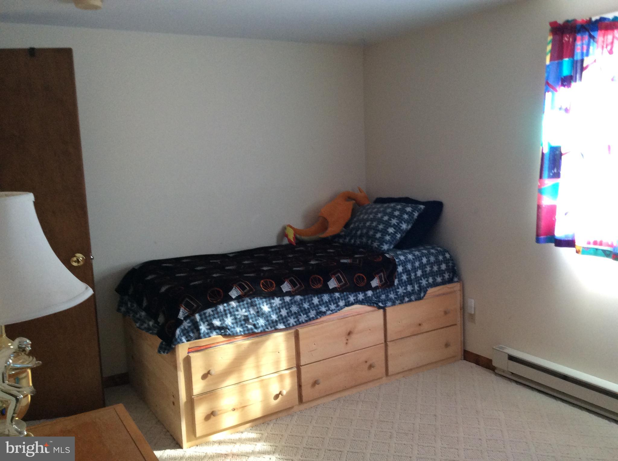 319 Red Lion Branch Road Millington, MD 21651 - Photo 21 of 31 a bed sitting in a bedroom next to a window