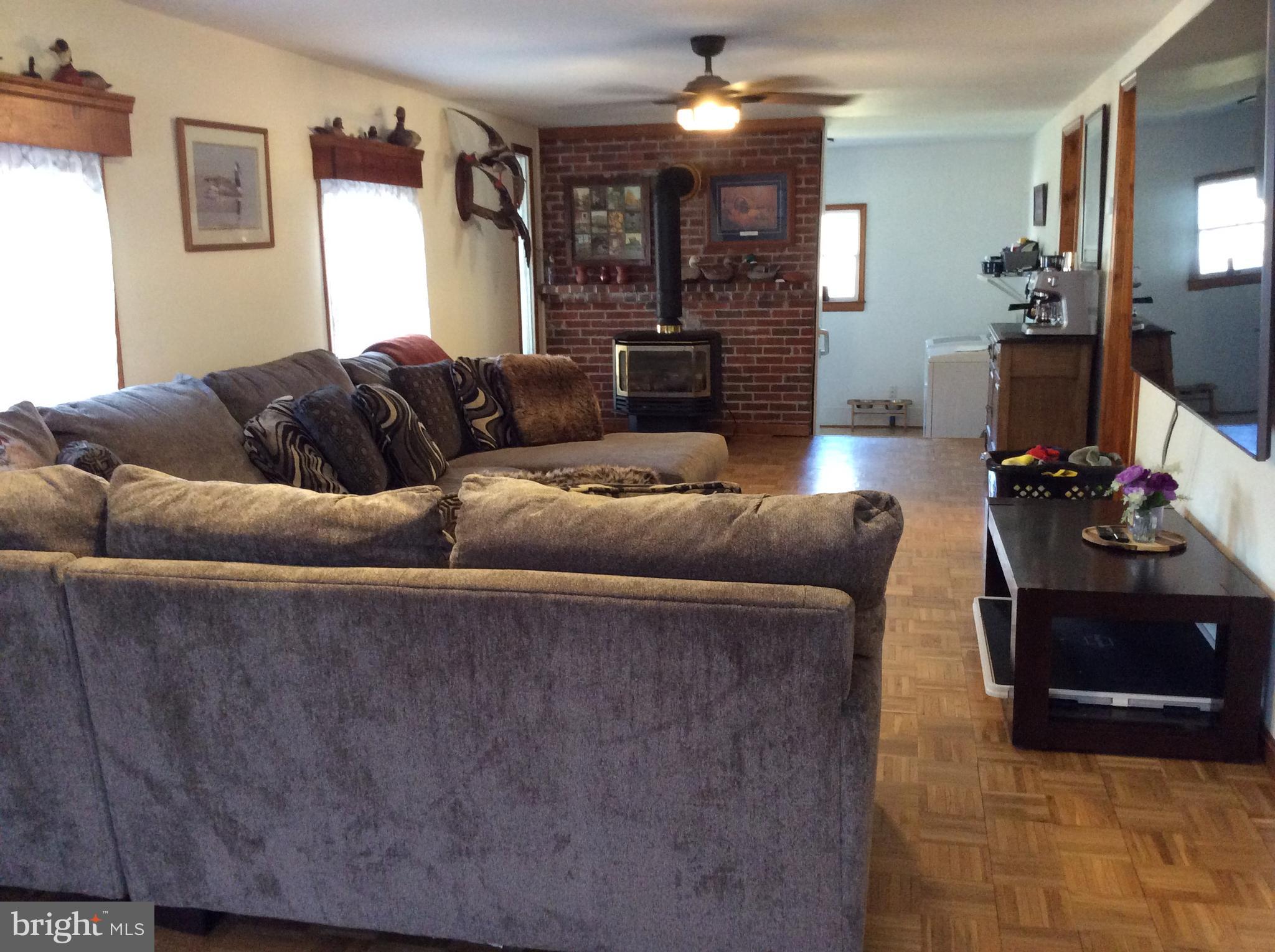 319 Red Lion Branch Road Millington, MD 21651 - Photo 4 of 31 a living room with furniture and a fireplace