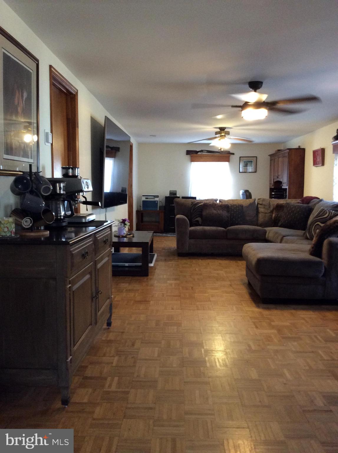 319 Red Lion Branch Road Millington, MD 21651 - Photo 6 of 31 a living room with furniture and a flat screen tv